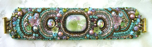 Elaborately beaded bracelet in turquoise, pinks, green