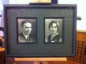 Professionally framed antique photos of man and woman