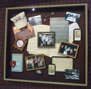 Shadow box filled with college memorabilia and photos