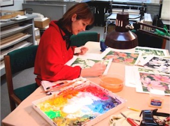 Artist Jennifer Bowman painting in her studio