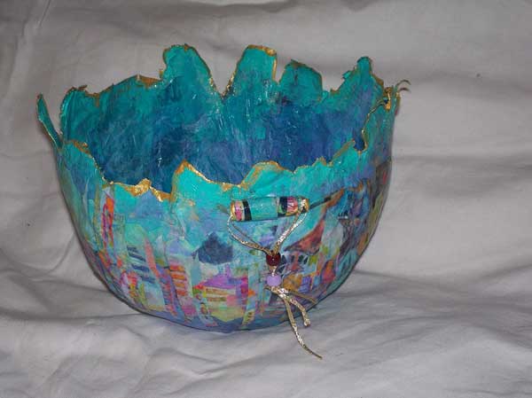 Blue, multi-media bowl with village scene around outside