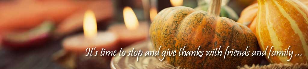 Autumn table setting with pumpkins. Message overlaid is, "It's time to stop and give thanks with friends and family."