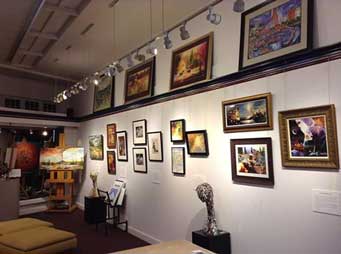 Paintings and sculpture exhibit inside Village Frame & Gallery