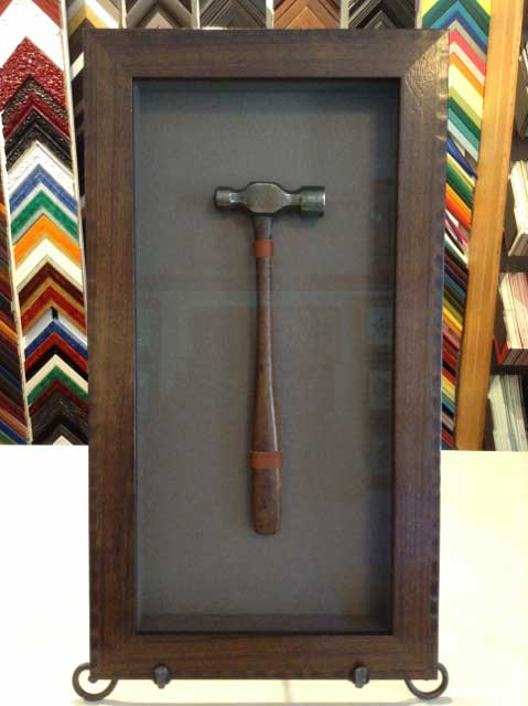 Vintage hammer in shadowbox frame