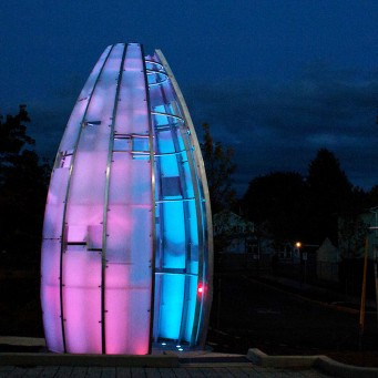 Heart Beacon sculpture lit up against night sky