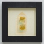 Glass sculpture on paper inside dark frame