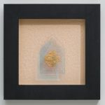 Glass sculpture on paper inside dark frame