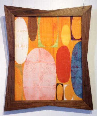 Mid-century modern art in wood frame with curved edges