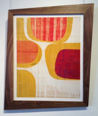 Mid-century modern art in wood frame with curved edges
