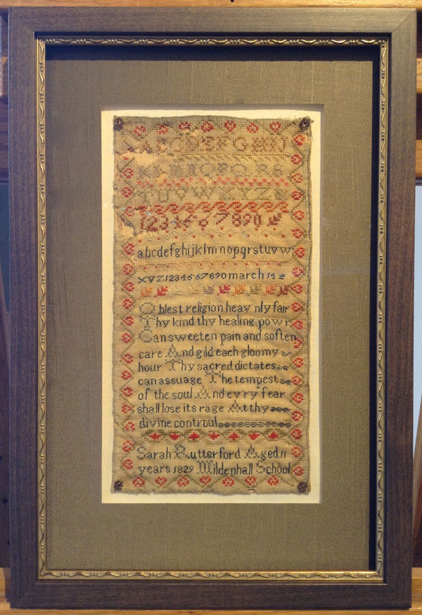 Framed antique embroidered sampler